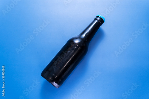 Beer bottle on a blue background