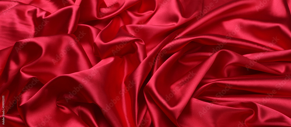 Red wave silk fabric horizontal long background. Red wave silk fabric horizontal long background.