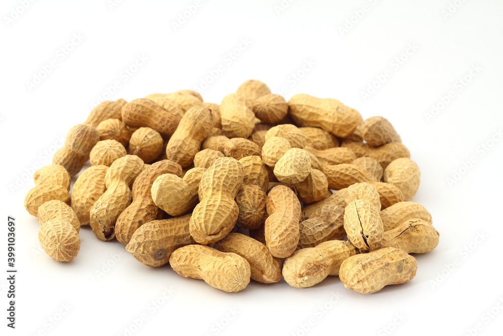 Peanuts in shell on a white background. Top view. Copy, empty space for text Peanuts in shell on a white background. Top view. Copy, empty space for text