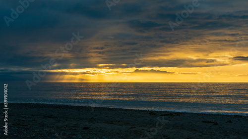 Sun rays shine during sunset after a stormy Pacific Northwest Afternoon