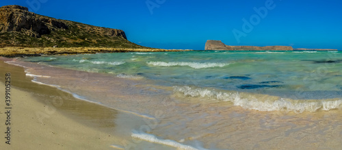 A view of Balos Beach and the azure lagoons out towards Gramvousa island, Crete on a bright sunny day