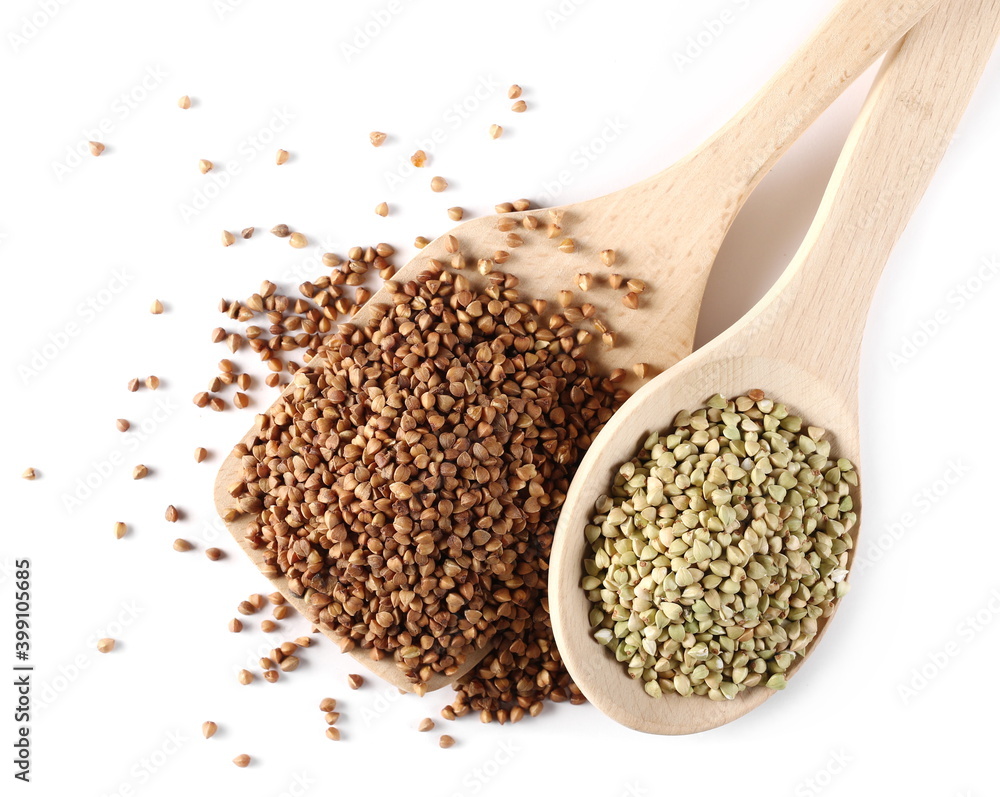Unpeeled and peeled buckwheat seeds in wooden spoon isolated on white background, top view Unpeeled and peeled buckwheat seeds in wooden spoon isolated on white background, top view