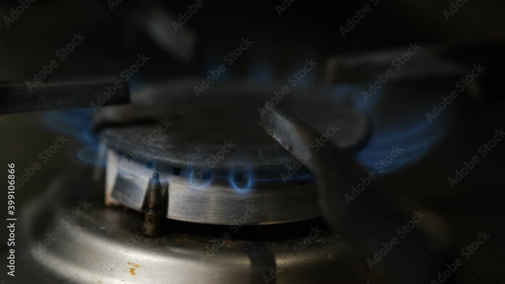 close-up of a fire burning on a gas stove close-up of a fire burning on a gas stove