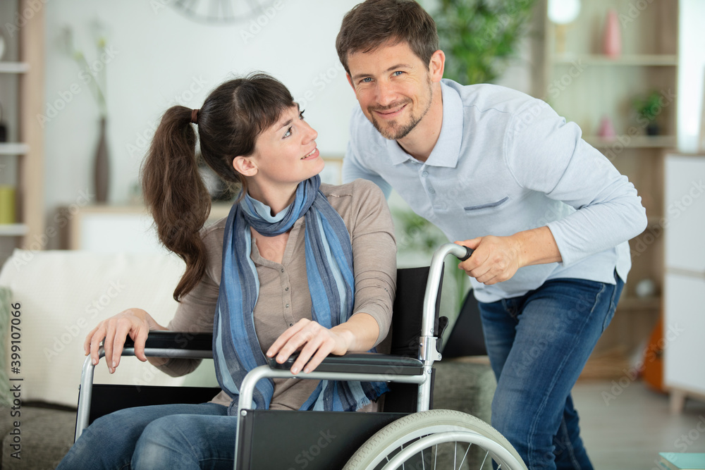 handicapped young pretty woman in wheelchair and her partner handicapped young pretty woman in wheelchair and her partner