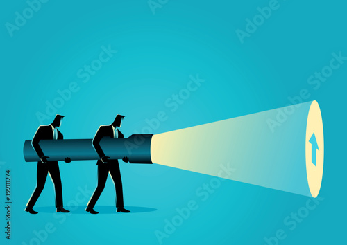 Businessmen holding a giant flashlight uncovering arrow sign