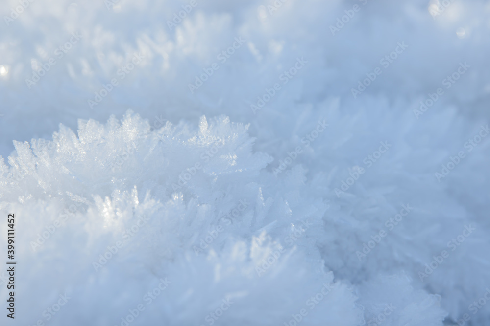 Hoarfrost background texture. Fresh ice and snow winter backdrop with snowflakes and mounds. Seasonal wallpaper. Frozen water geometrical shapes and figures. Cold weather atmospheric precipitation. Hoarfrost background texture. Fresh ice and snow winter backdrop with snowflakes and mounds. Seasonal wallpaper. Frozen water geometrical shapes and figures. Cold weather atmospheric precipitation.