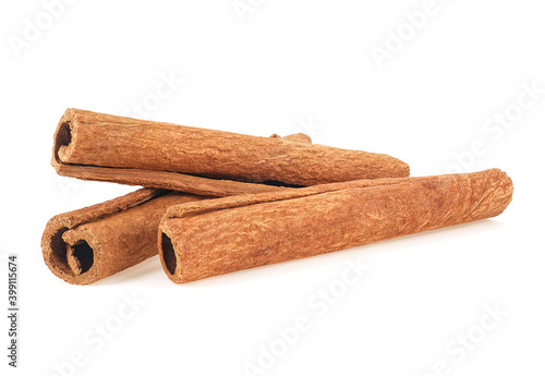 Aromatic cinnamon sticks isolated on a white background. Three cinnamon sticks.