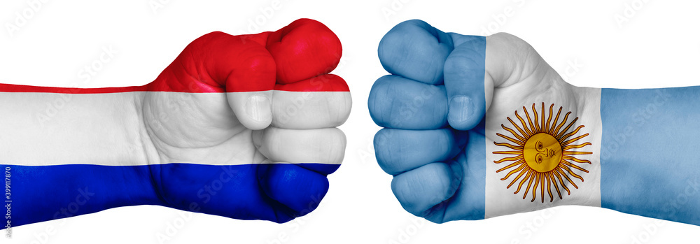 Fototapeta premium Two hands are clenched into fists and are located opposite each other. Hands painted in the colors of the flags of the countries. France vs Argentina