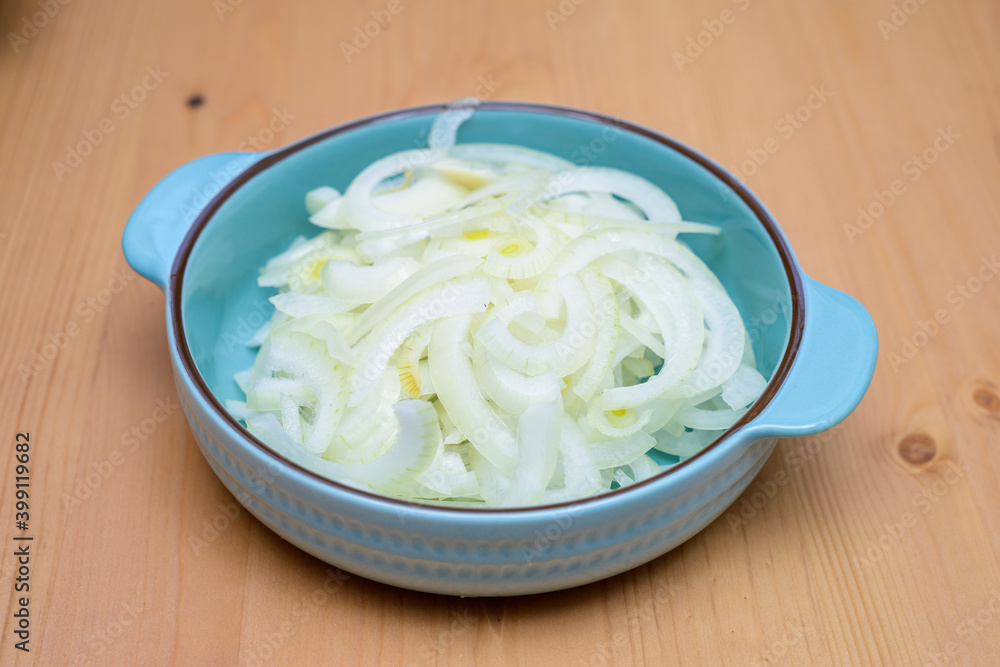 sliced onion in a bowl sliced onion in a bowl