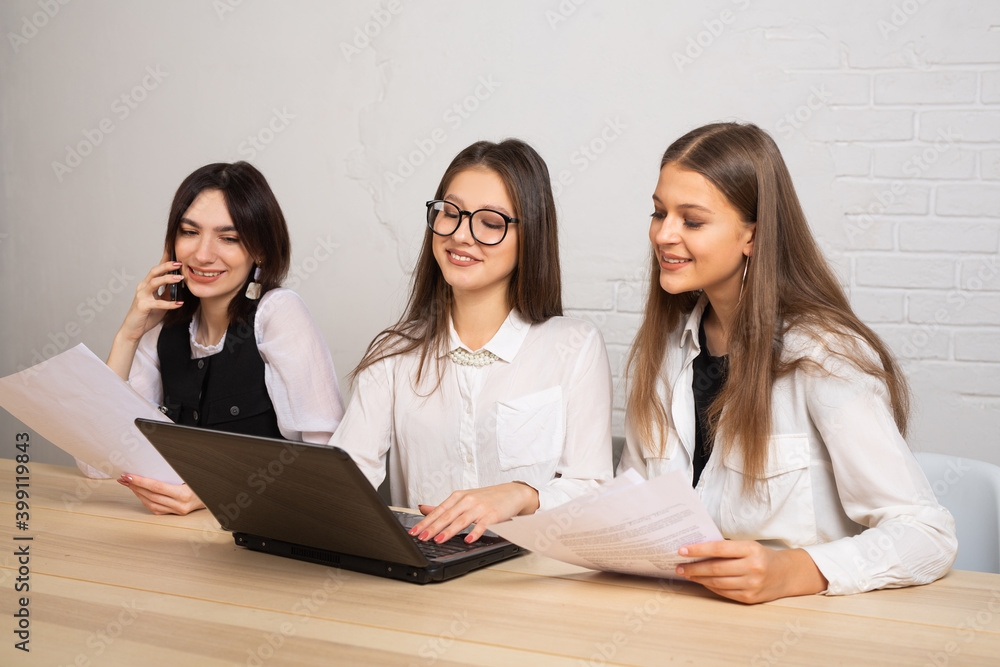 beautiful young women in office with laptop beautiful young women in office with laptop
