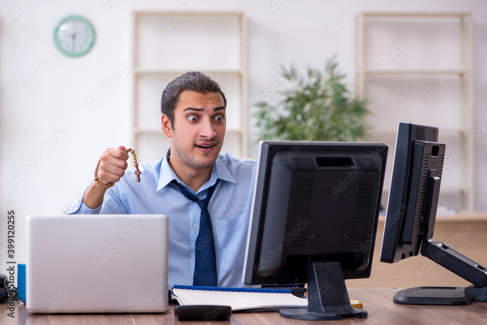 Young male employee unhappy with excessive work Young male employee unhappy with excessive work