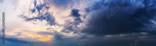 Fototapeta Naklejka Na Ścianę i Meble -  Dramatic sunset sky with dark clouds.