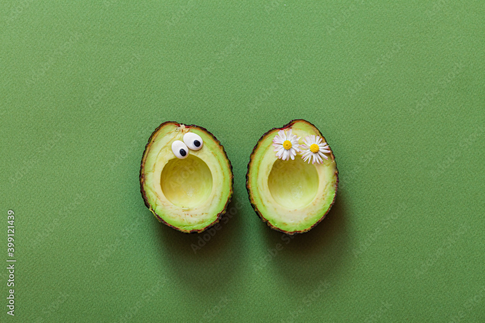 funny avocado on the green background