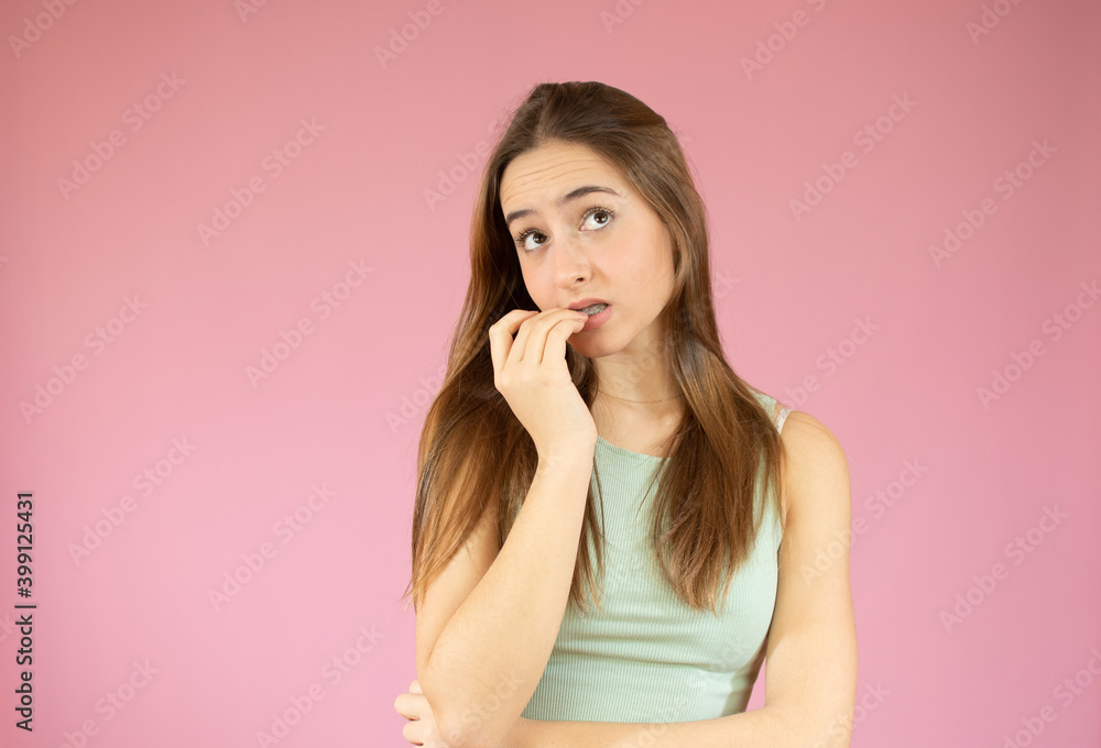 Beautiful caucasian young woman thinking isolated over pink background Beautiful caucasian young woman thinking isolated over pink background