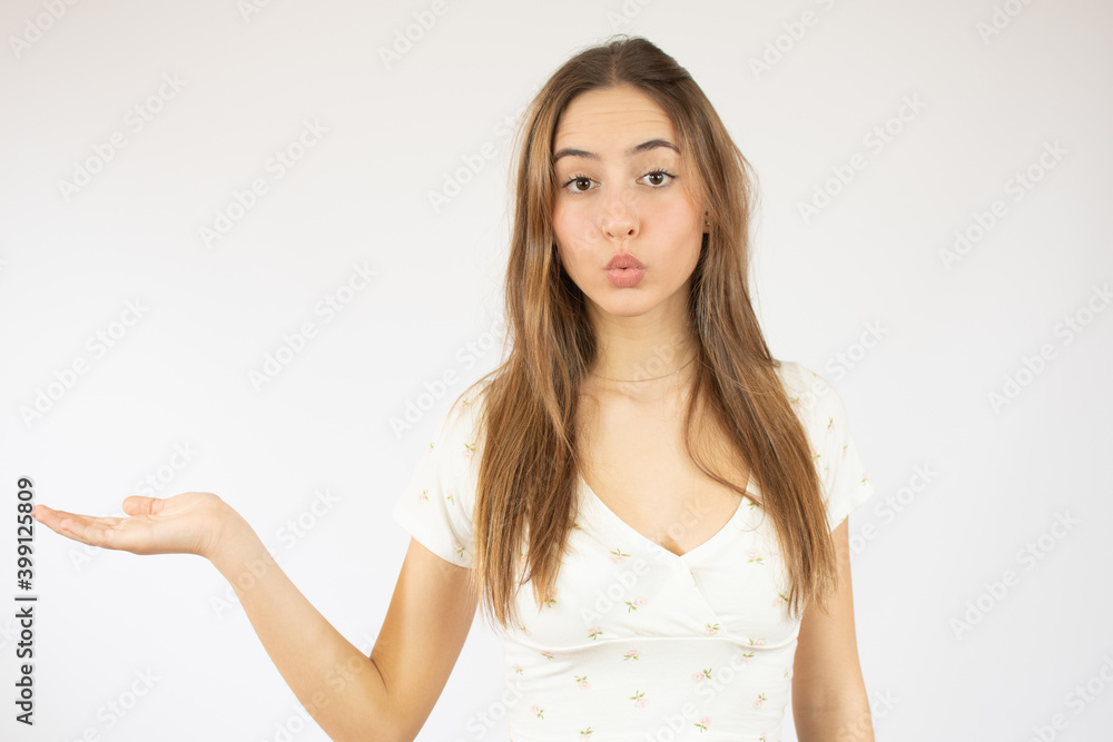 Beautiful caucasian young woman showing product isolate over white background Beautiful caucasian young woman showing product isolate over white background