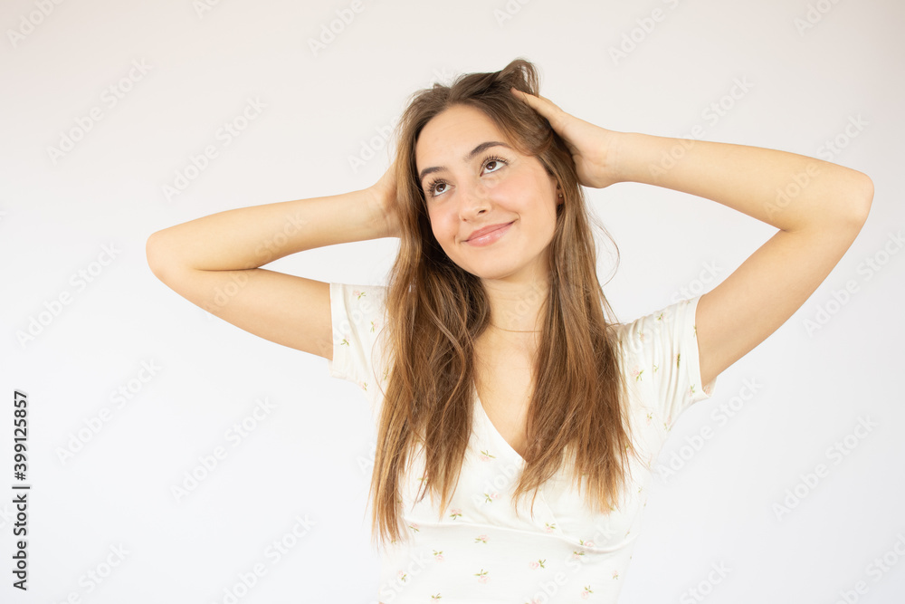 Young beautiful woman wearing sweater over white isolated background Hugging oneself happy and positive, smiling confident. Self love and self care