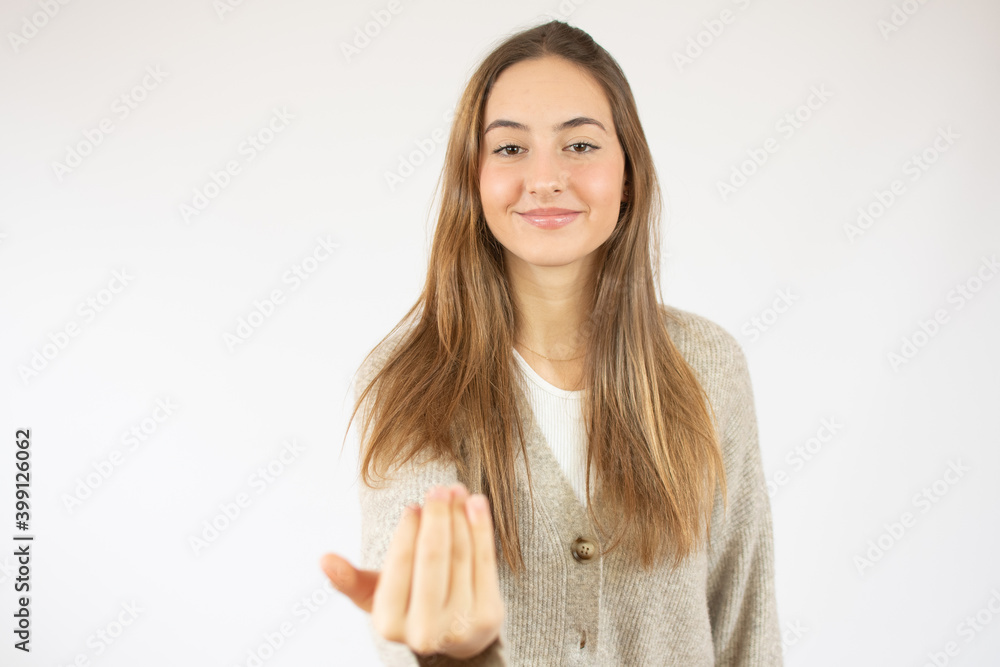 Young woman over isolated white background inviting to come with hand. Happy that you came Young woman over isolated white background inviting to come with hand. Happy that you came