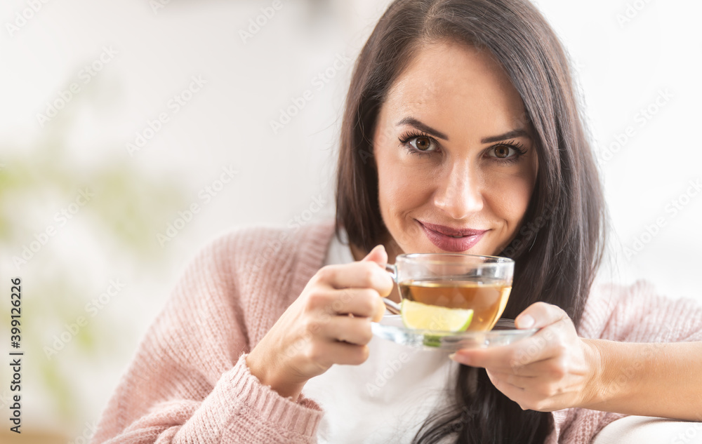 Senseful tea experience of herbal or green tea by a beautiful woman Senseful tea experience of herbal or green tea by a beautiful woman