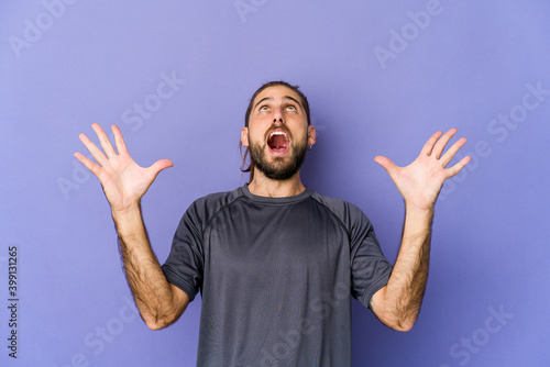 Fotografie Young man with long hair look having fun covering half of face with palm