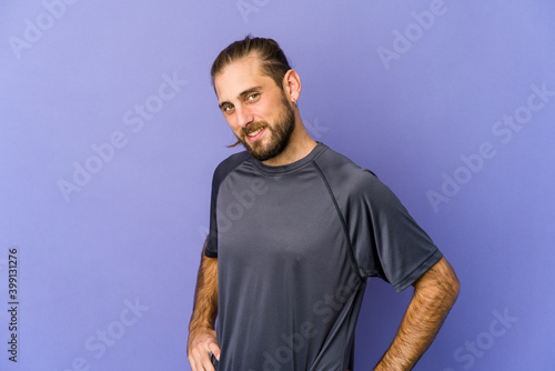 Tableau sur toile Young man with long hair look feeling energetic and comfortable, rubbing hands confident