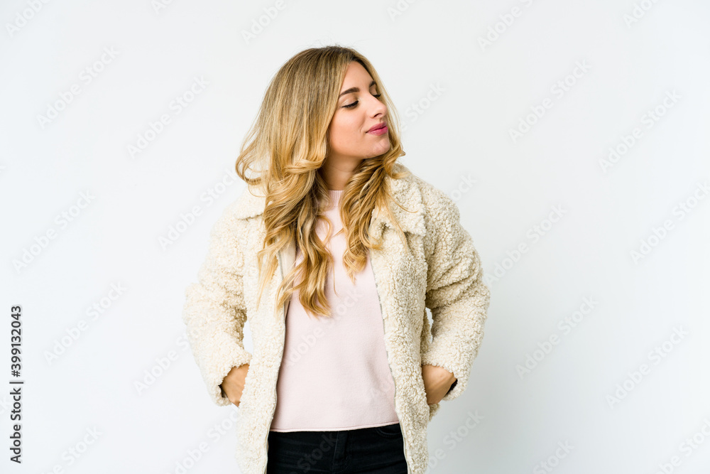 Young caucasian blonde woman dreaming of achieving goals and purposes Young caucasian blonde woman dreaming of achieving goals and purposes