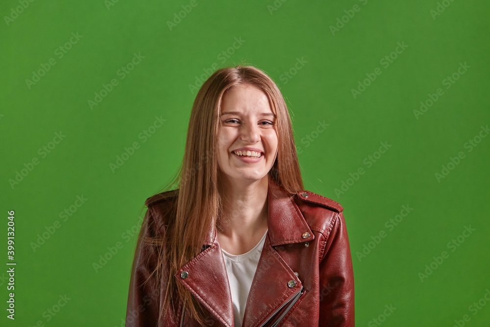 Happy beautiful smiling, laughing young woman. Green background. Long blond hair. Happy beautiful smiling, laughing young woman. Green background. Long blond hair.