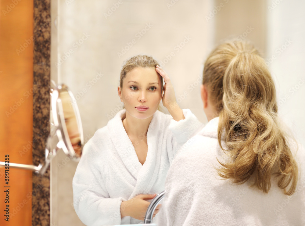 Magic anti-aging cream.Applying the cream. woman moisturizing face mask. Cosmetology and skin care concept.. Magic anti-aging cream.Applying the cream. woman moisturizing face mask. Cosmetology and skin care concept..