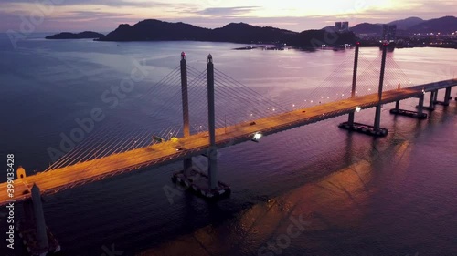 Nice dramatic sunset over Penang Second Bridge. Batu Maung development. photo