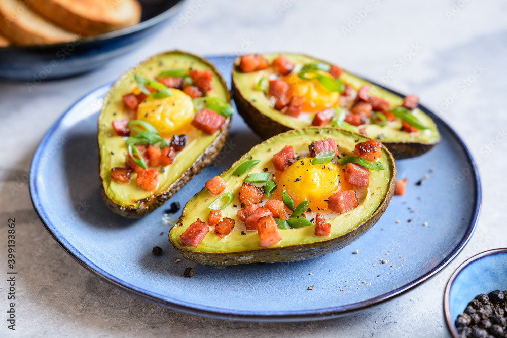 Avocado egg boats with bacon and green onion