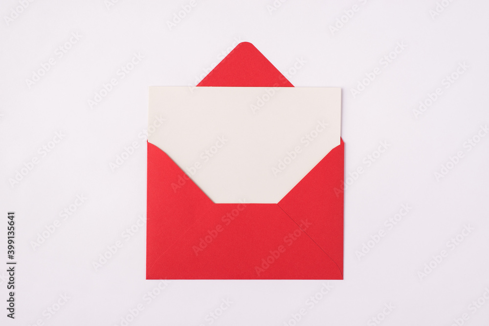 Photo of red open unwrapped envelope with empty letter inside isolated white background Photo of red open unwrapped envelope with empty letter inside isolated white background
