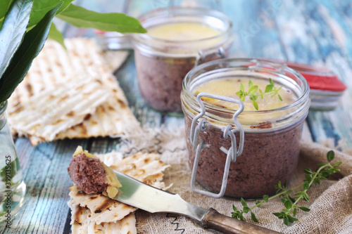 Faux gras. Vegetable Foie Gras from lentils and beets in jar and crispbread photo