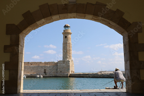 A fisherman on the Venetian port of Rethymno in Crete, Greece