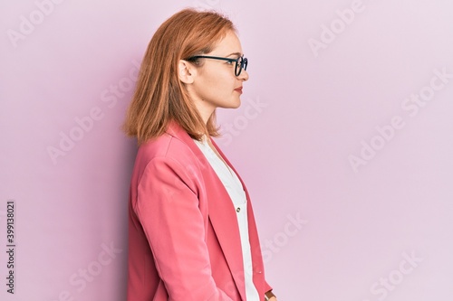 Obraz na plátně Young caucasian woman wearing business style and glasses looking to side, relax profile pose with natural face and confident smile