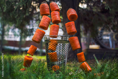 carrots flying in the air with a beautiful background
 photo