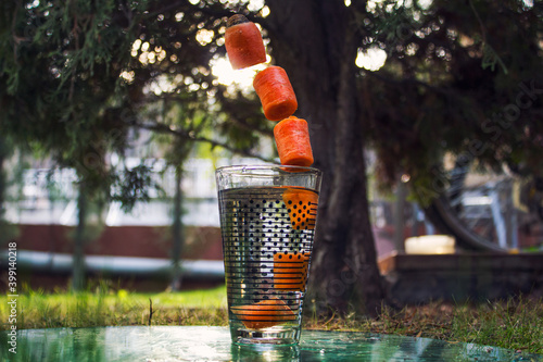 carrots flying in the air with a beautiful background
 photo