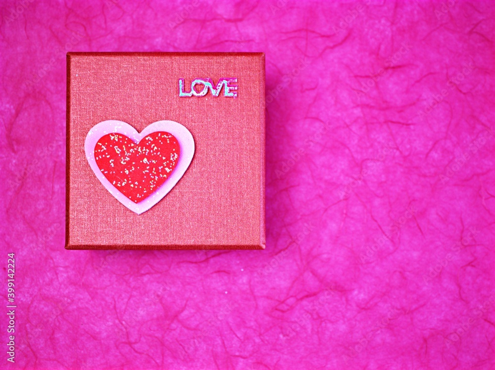 red gift box with heart isolated on pink background ,pink box for valentines day card	