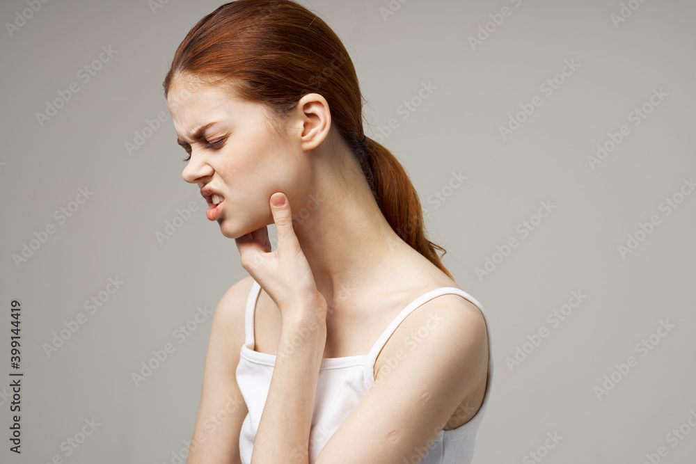 woman in white t-shirt holds hand of owner toothache emotion model woman in white t-shirt holds hand of owner toothache emotion model
