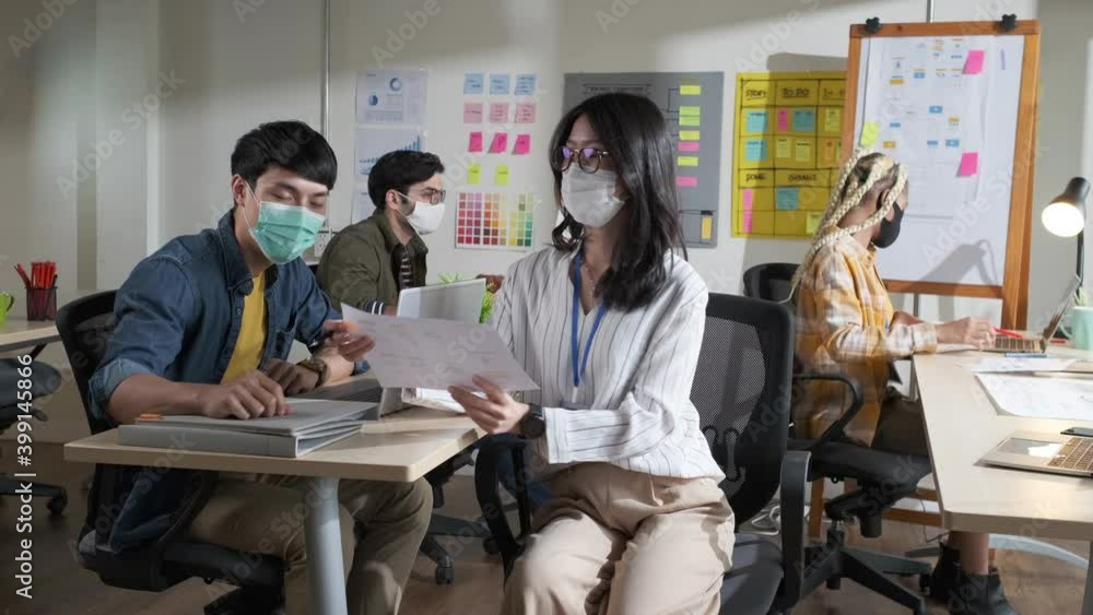 4k slow motion Asian creative business team working at office after lockdown with protective prevention face mask. 4k slow motion Asian creative business team working at office after lockdown with protective prevention face mask.