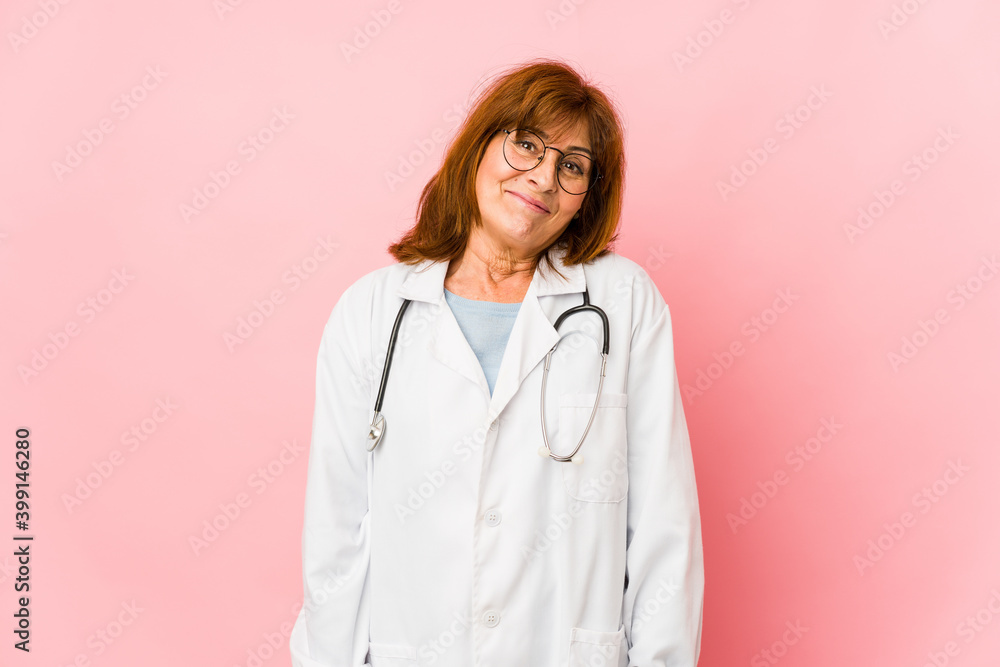 Middle age caucasian doctor woman isolated dreaming of achieving goals and purposes Middle age caucasian doctor woman isolated dreaming of achieving goals and purposes