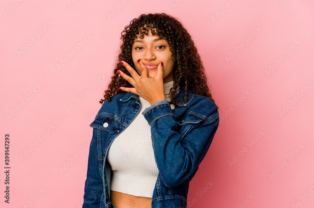 Young african american afro woman isolated doubting between two options. Young african american afro woman isolated doubting between two options.