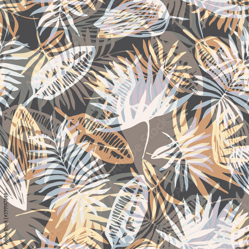 Fashion seamless pattern with overlap mess of neutral colors tropical leaves on brown background. Trendy exotic plants texture for textile, wrapping paper, surface, wallpaper, background