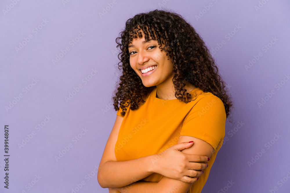 Young african american afro woman isolated laughing and having fun. Young african american afro woman isolated laughing and having fun.
