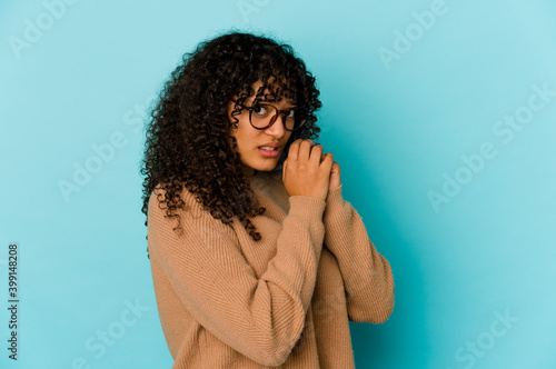 Young african american afro woman isolated scared and afraid.