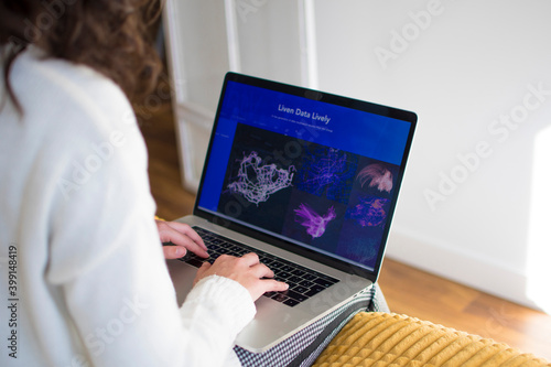 Young woman working from home with laptop