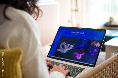 Young woman working from home with laptop