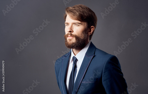 Bearded man in suit emotions gestures with hands close-up Studio