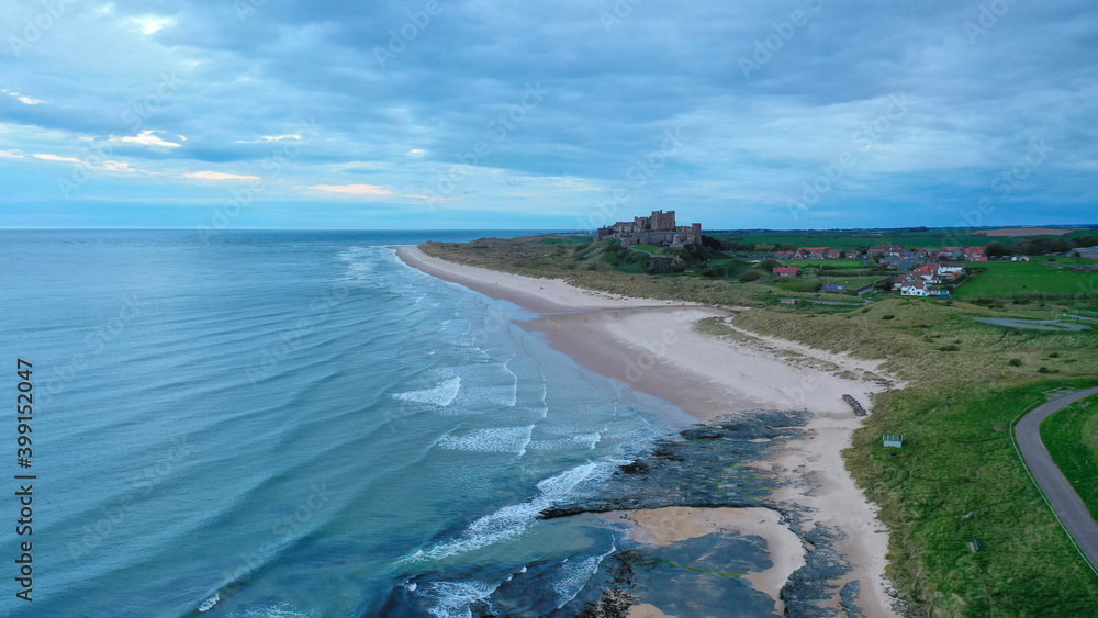 Bamburgh Castle at a distance over the sand