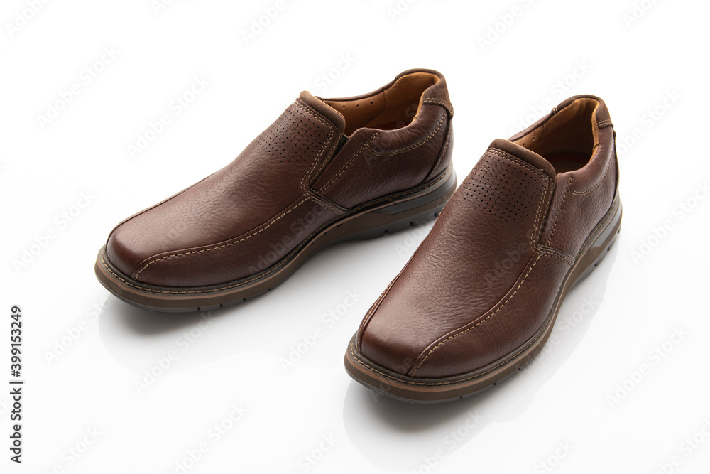 Pair of Brown Slip on Shoes Isolated on White Background Pair of Brown Slip on Shoes Isolated on White Background