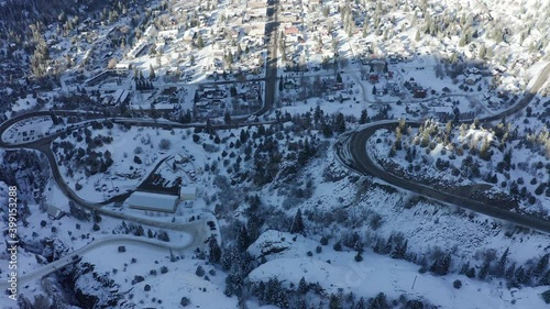 4K Aerial Flyover of Ouray Colorado town snowy winter