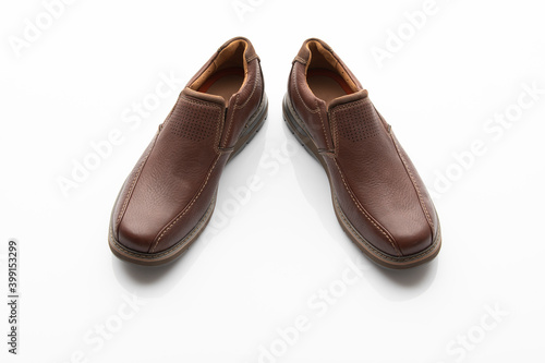 Pair of Brown Slip on Shoes Isolated on White Background © niteenrk